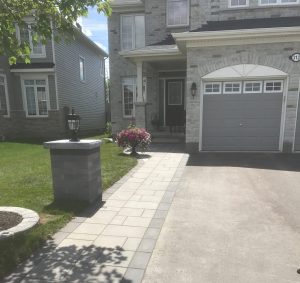 driveway widening grey stones grey house
